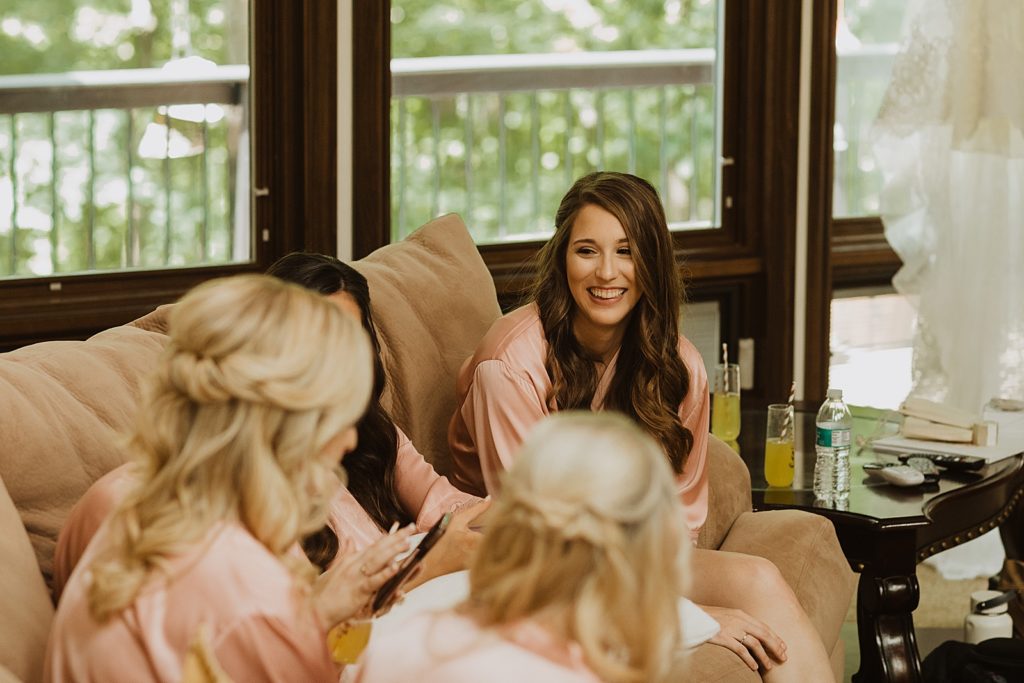Bridesmaids getting ready and laughing