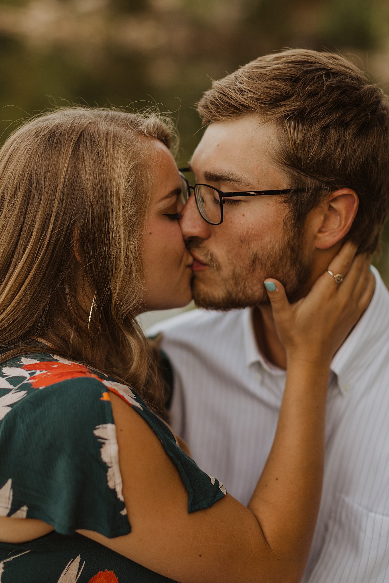Klondike Park Engagement Pictures | Couple kissing near a lake