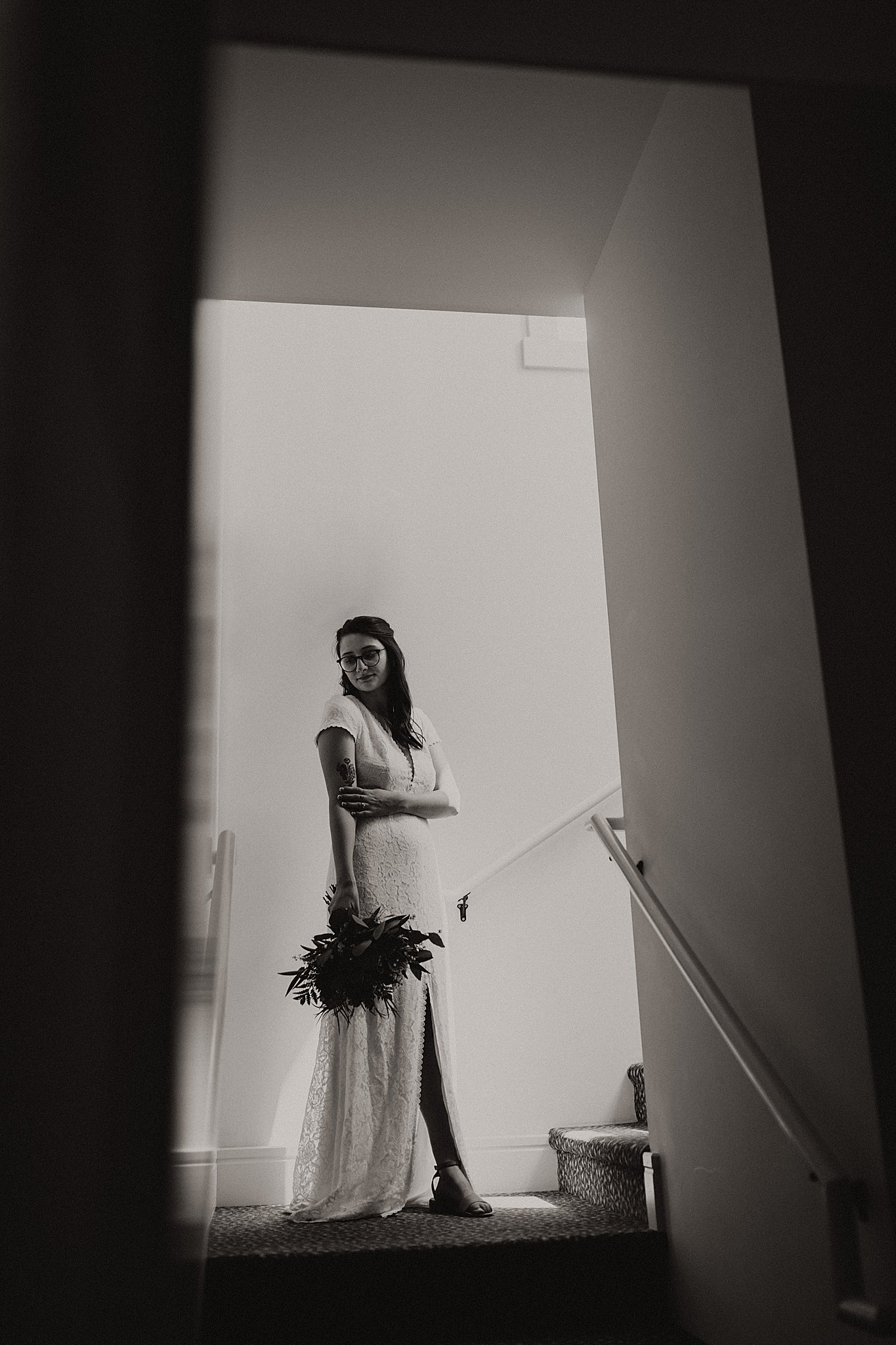 Bride standing in window light at New Town Chapel