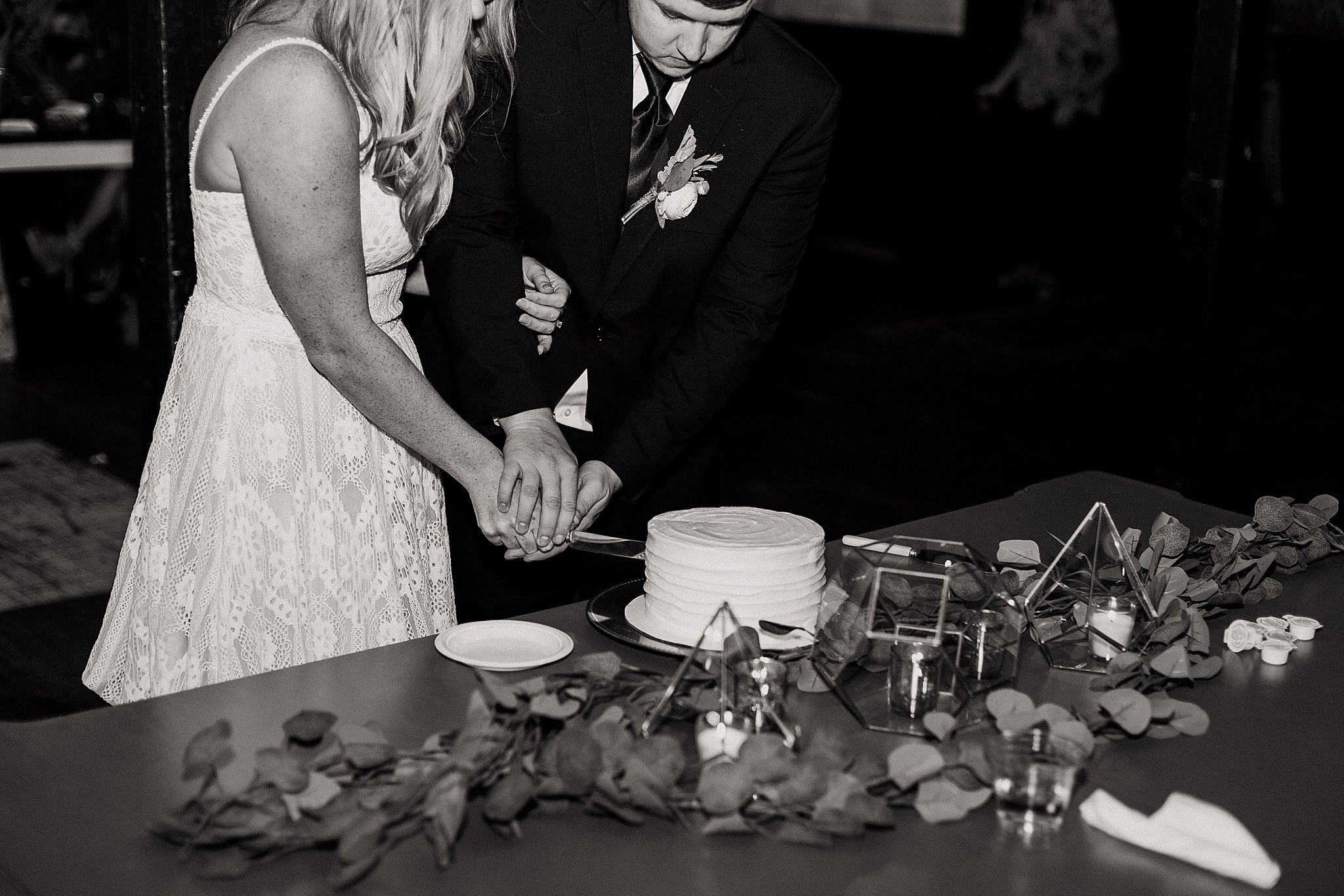 Bride and Groom Cutting Cake