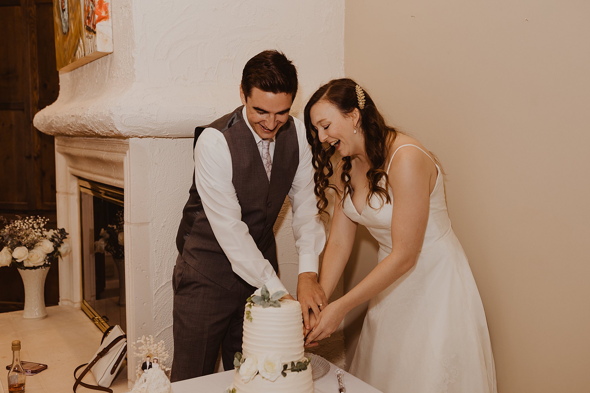 Bride and Groom Cutting Cake