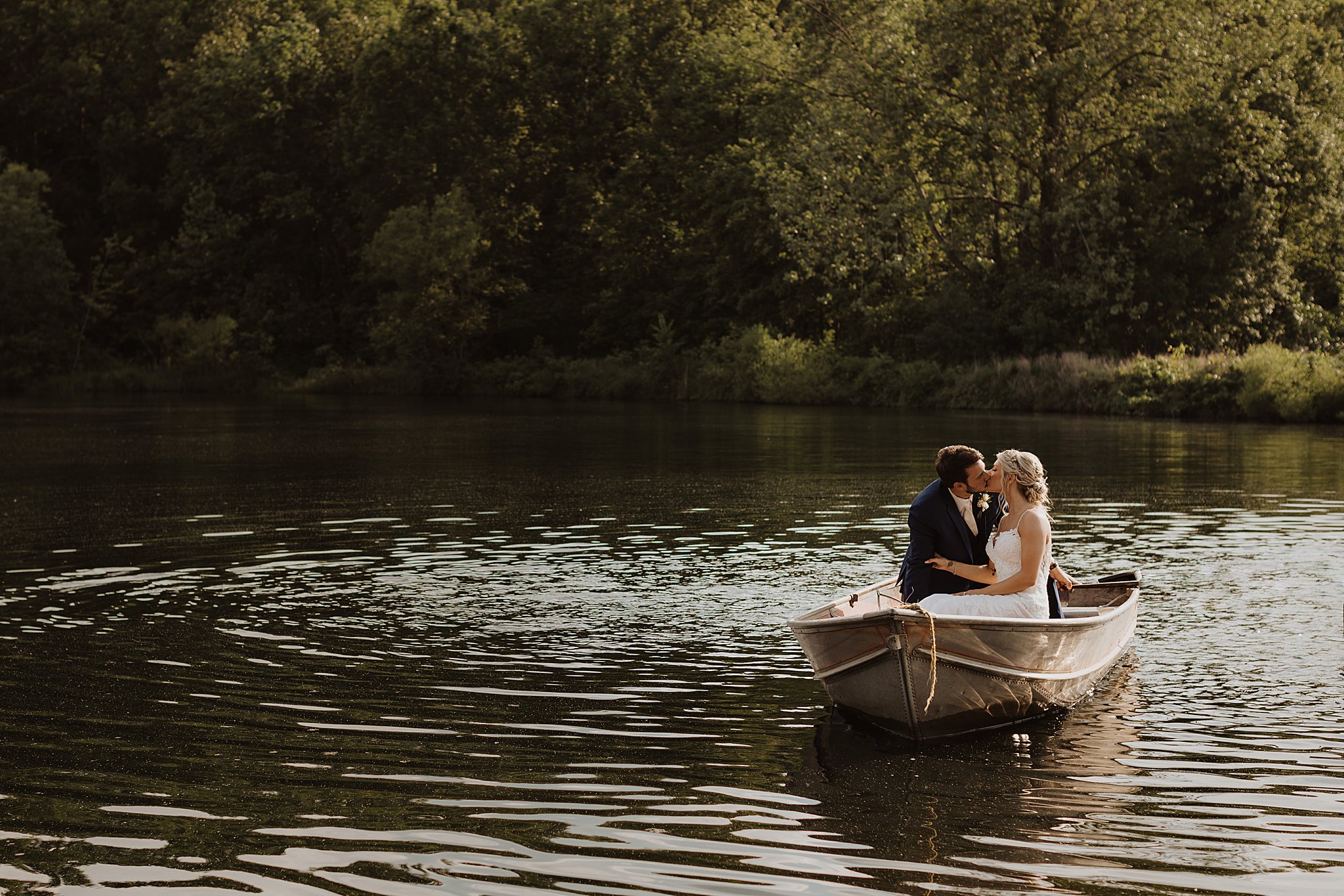 Bride and Groom in a boat at Little Piney Lodge in Hermann MO.