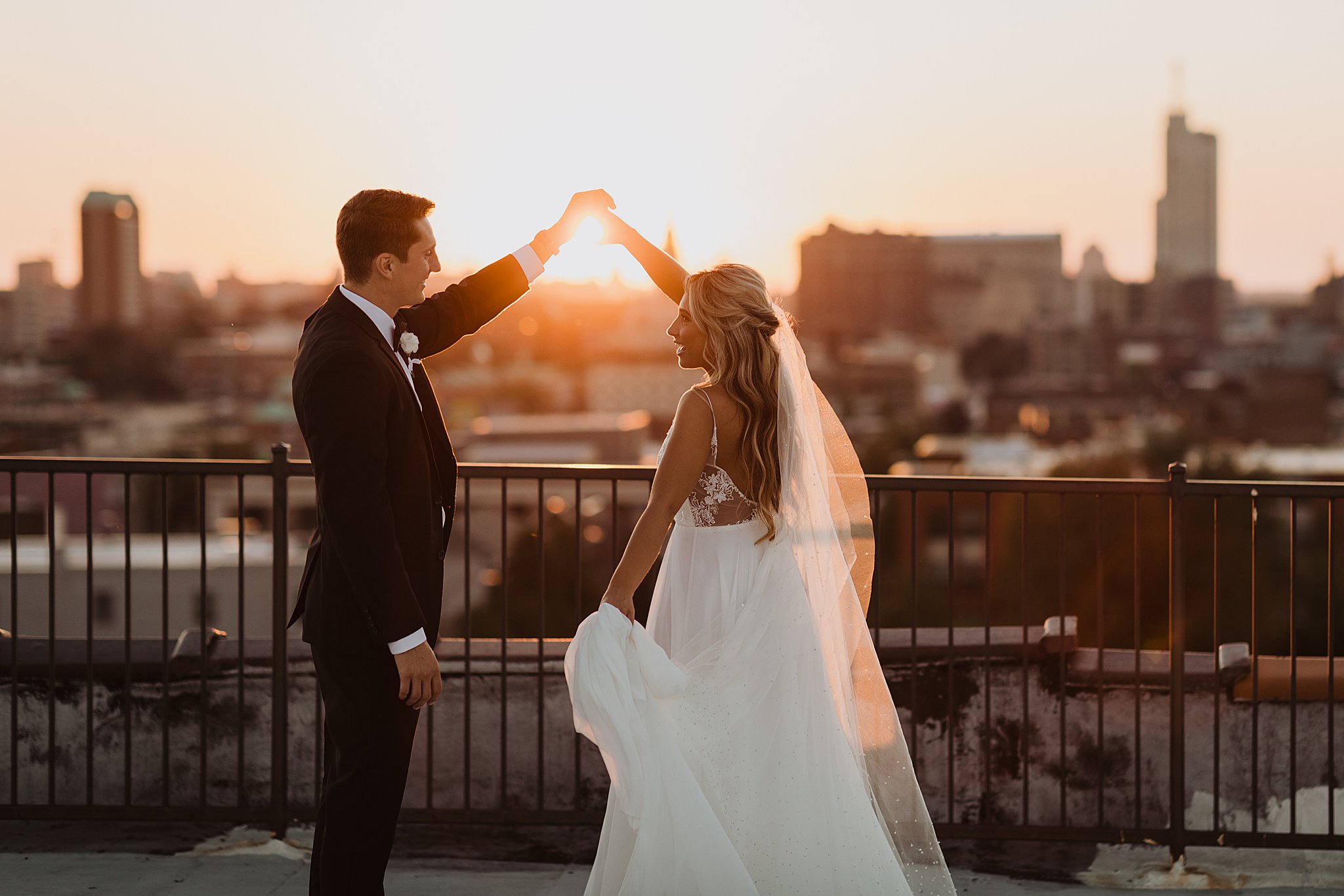 Bride and Groom Dancing on Rooftop in STL at Sunset