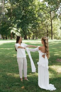Bride and bride sharing a first look in Tower Grove Park before their Wild Carrot wedding in St. Louis.
