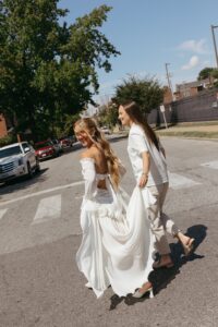 Bride and bride sharing a first look in Tower Grove Park before their Wild Carrot wedding in St. Louis.
