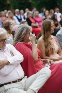 Outdoor sunset ceremony at Wild Carrot in St. Louis during a summer wedding with elegant calla lily flowers and a warm golden evening glow.