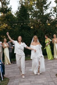 Outdoor sunset ceremony at Wild Carrot in St. Louis during a summer wedding with elegant calla lily flowers and a warm golden evening glow.