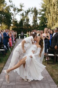 Outdoor sunset ceremony at Wild Carrot in St. Louis during a summer wedding with elegant calla lily flowers and a warm golden evening glow.