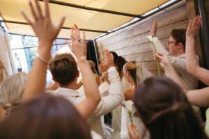 Outdoor sunset ceremony at Wild Carrot in St. Louis during a summer wedding with elegant calla lily flowers and a warm golden evening glow.