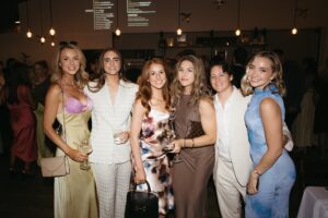 Outdoor sunset ceremony at Wild Carrot in St. Louis during a summer wedding with elegant calla lily flowers and a warm golden evening glow.