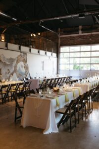 Outdoor sunset ceremony at Wild Carrot in St. Louis during a summer wedding with elegant calla lily flowers and a warm golden evening glow.