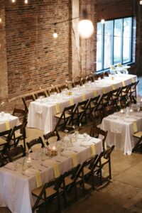 Outdoor sunset ceremony at Wild Carrot in St. Louis during a summer wedding with elegant calla lily flowers and a warm golden evening glow.