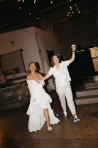 Outdoor sunset ceremony at Wild Carrot in St. Louis during a summer wedding with elegant calla lily flowers and a warm golden evening glow.