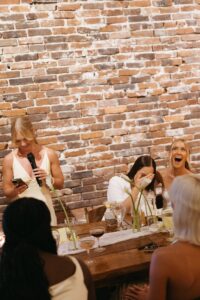 Outdoor sunset ceremony at Wild Carrot in St. Louis during a summer wedding with elegant calla lily flowers and a warm golden evening glow.