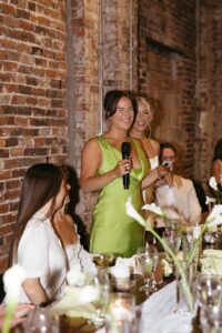 Outdoor sunset ceremony at Wild Carrot in St. Louis during a summer wedding with elegant calla lily flowers and a warm golden evening glow.