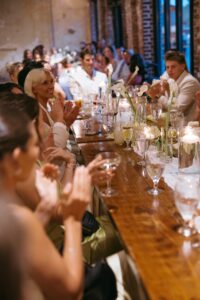 Outdoor sunset ceremony at Wild Carrot in St. Louis during a summer wedding with elegant calla lily flowers and a warm golden evening glow.