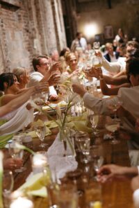 Outdoor sunset ceremony at Wild Carrot in St. Louis during a summer wedding with elegant calla lily flowers and a warm golden evening glow.