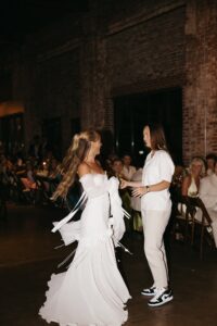 Outdoor sunset ceremony at Wild Carrot in St. Louis during a summer wedding with elegant calla lily flowers and a warm golden evening glow.