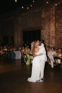 Outdoor sunset ceremony at Wild Carrot in St. Louis during a summer wedding with elegant calla lily flowers and a warm golden evening glow.