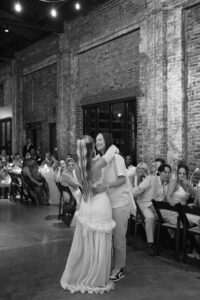 Outdoor sunset ceremony at Wild Carrot in St. Louis during a summer wedding with elegant calla lily flowers and a warm golden evening glow.