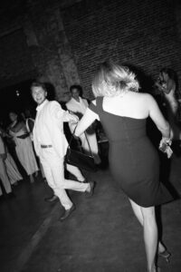 Outdoor sunset ceremony at Wild Carrot in St. Louis during a summer wedding with elegant calla lily flowers and a warm golden evening glow.