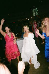 Outdoor sunset ceremony at Wild Carrot in St. Louis during a summer wedding with elegant calla lily flowers and a warm golden evening glow.