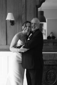 Romantic rainy day portrait of Isabella and Joseph during their St. Louis Art Museum wedding captured by a St. Louis wedding photographer.