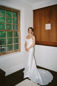 Romantic rainy day portrait of Isabella and Joseph during their St. Louis Art Museum wedding captured by a St. Louis wedding photographer.