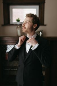 Romantic rainy day portrait of Isabella and Joseph during their St. Louis Art Museum wedding captured by a St. Louis wedding photographer.