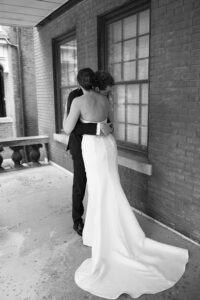 Bride and groom sharing a first look at an Airbnb before their St. Louis Art Museum wedding in Forest Park.