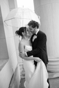 Intimate indoor ceremony during a rainy day St. Louis Art Museum wedding with pastel florals and pale blue bridesmaid dresses.