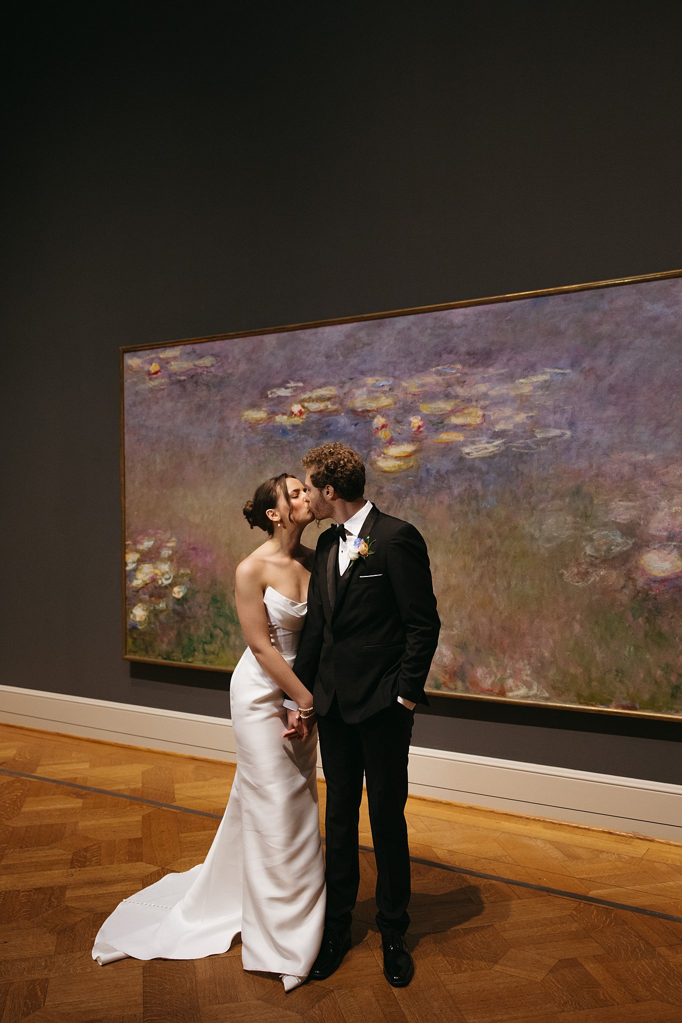 Intimate indoor ceremony during a rainy day St. Louis Art Museum wedding with pastel florals and pale blue bridesmaid dresses.