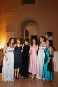 Elegant wedding reception inside the St. Louis Art Museum main hall with pastel floral arrangements and grand architecture.