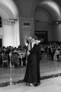 Elegant wedding reception inside the St. Louis Art Museum main hall with pastel floral arrangements and grand architecture.