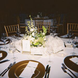 Elegant wedding reception inside the St. Louis Art Museum main hall with pastel floral arrangements and grand architecture.