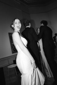 Elegant wedding reception inside the St. Louis Art Museum main hall with pastel floral arrangements and grand architecture.