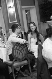 bride wearing her mother and grandmother's altered wedding dress at rehearsal dinner at Forest Hills Country Club