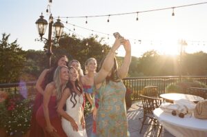 bride wearing her mother and grandmother's altered wedding dress at rehearsal dinner at Forest Hills Country Club