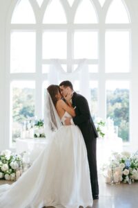emotional indoor wedding ceremony in the chandelier room at Westwind Hills in St Louis