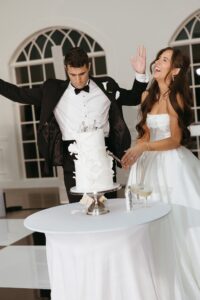 reception at Westwind Hills with black and white dance floor under large chandelier