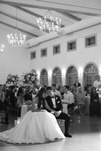 reception at Westwind Hills with black and white dance floor under large chandelier